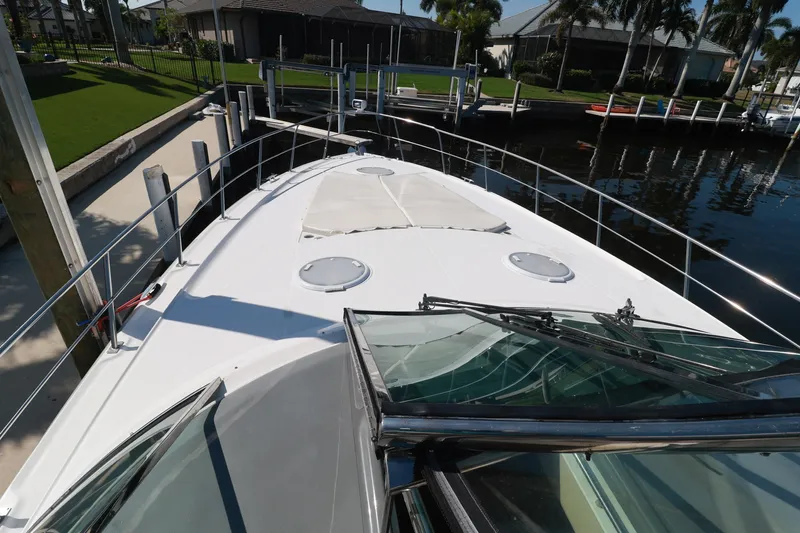 Nauti Buoy Yacht Photos Pics 2007 Cruisers 520 Express yacht docked, showcasing sleek deck design and waterfront setting.