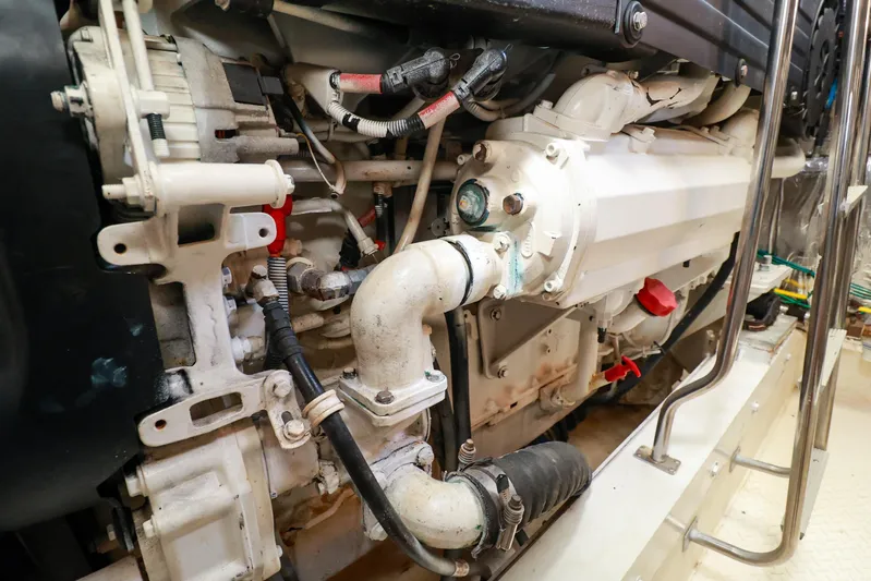 Nauti Buoy Yacht Photos Pics Engine compartment of a 2007 Cruisers 520 Express yacht, showcasing mechanical components.