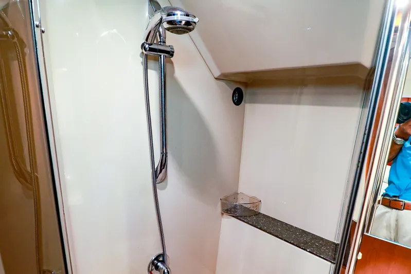 Nauti Buoy Yacht Photos Pics 2007 Cruisers 520 Express yacht shower with chrome fixtures and glass door.