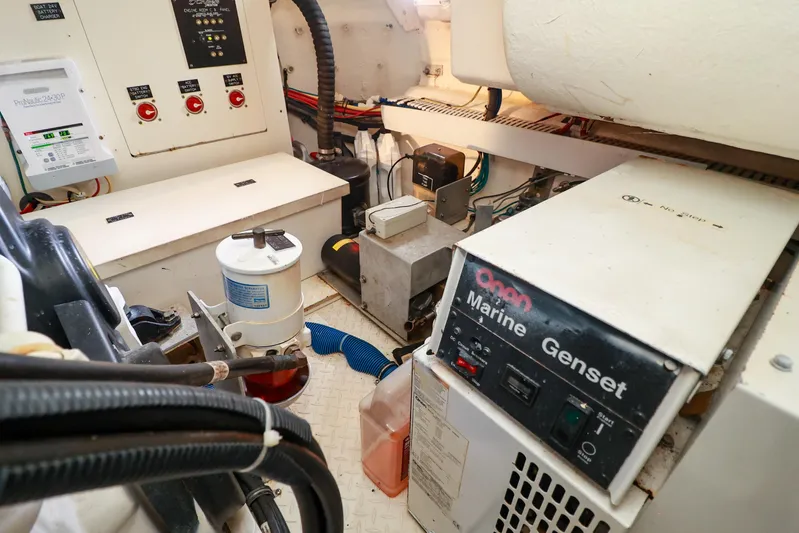 Nauti Buoy Yacht Photos Pics Engine room of a 2007 Cruisers 520 Express with Onan Marine Genset.