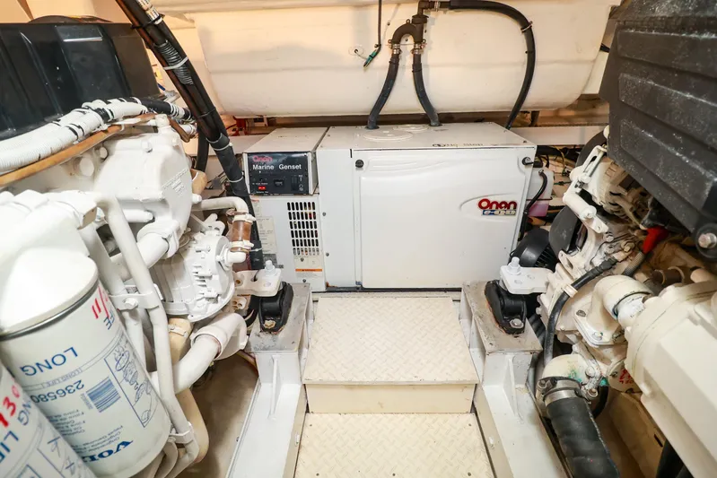 Nauti Buoy Yacht Photos Pics Engine room of 2007 Cruisers 520 Express with Onan marine generator and mechanical components.