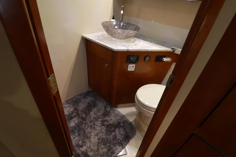 Nauti Buoy Yacht Photos Pics 2007 Cruisers 520 Express yacht bathroom with modern sink and plush rug.
