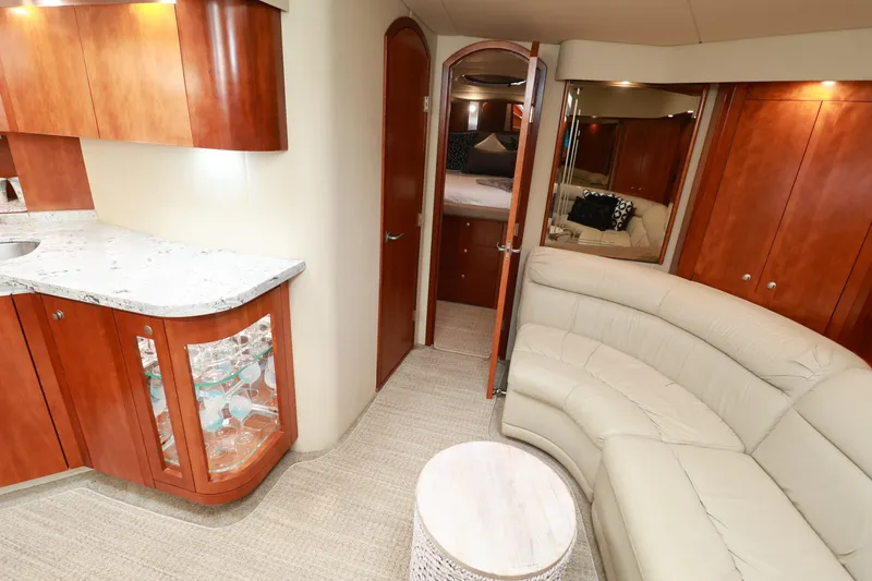 Nauti Buoy Yacht Photos Pics Luxurious interior of 2007 Cruisers 520 Express yacht with elegant seating and modern cabinetry.