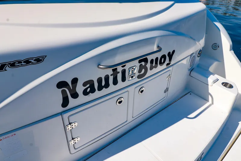Nauti Buoy Yacht Photos Pics 2007 Cruisers 520 Express boat with "Nauti Buoy" name on the stern.