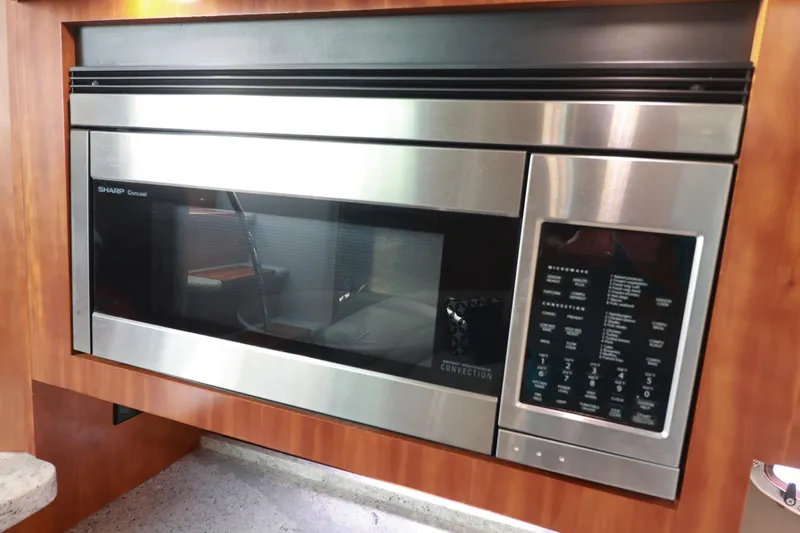 Nauti Buoy Yacht Photos Pics Built-in Sharp Carousel microwave in 2007 Cruisers 520 Express yacht kitchen.