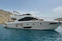 2008 Intermare 50 Fly Bridge yacht on calm blue water, coastal backdrop.
