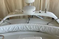 2008 Intermare 50 Fly Bridge yacht with radar equipment and cushioned seating area.