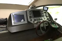 Helm of 2008 Intermare 50 Fly Bridge yacht with navigation screens and controls.