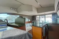 Interior of 2008 Intermare 50 Fly Bridge yacht, featuring modern kitchen and seating area.