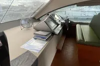 Interior of 2008 Intermare 50 Fly Bridge yacht with helm and seating area.
