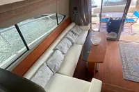 Interior of 2008 Intermare 50 Fly Bridge yacht with elegant seating and wooden table.
