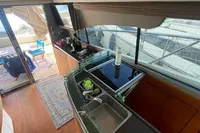 2008 Intermare 50 Fly Bridge yacht interior with modern kitchen and large windows.