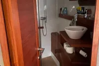 Bathroom interior of 2008 Intermare 50 Fly Bridge yacht, featuring modern fixtures and wooden accents.