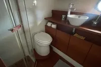 2008 Intermare 50 Fly Bridge yacht bathroom with shower, sink, and toilet.