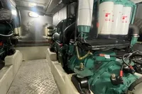 Engine room of 2008 Intermare 50 Fly Bridge yacht, showcasing mechanical components and systems.