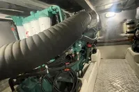 Engine room of 2008 Intermare 50 Fly Bridge yacht, featuring mechanical components and piping.