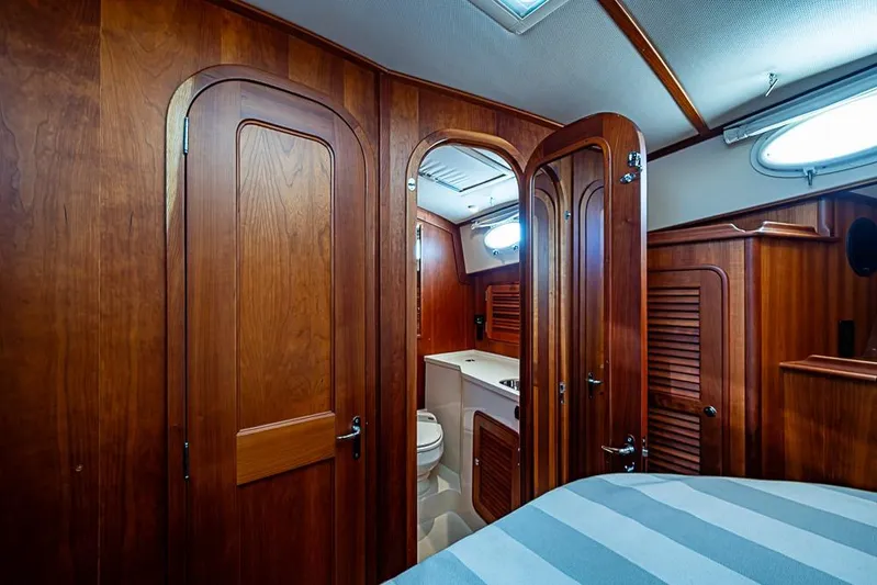 Skylark Yacht Photos Pics Luxurious wooden interior of 2008 Hinckley Talaria 44 MY yacht cabin with ensuite bathroom.