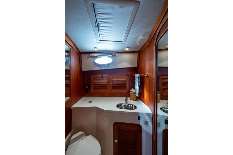 Skylark Yacht Photos Pics Luxurious bathroom interior of 2008 Hinckley Talaria 44 MY yacht with wood accents.