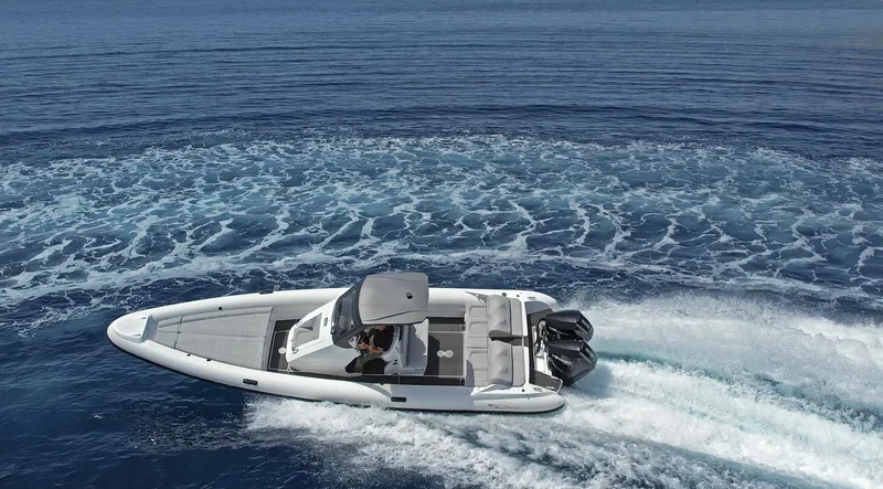  Yacht Photos Pics 2025 Ribco Venom 30 speedboat cruising on open water, leaving a trail of waves.