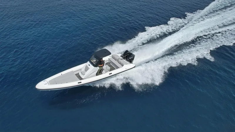  Yacht Photos Pics 2025 Ribco Venom 30 speedboat cruising on open blue water.