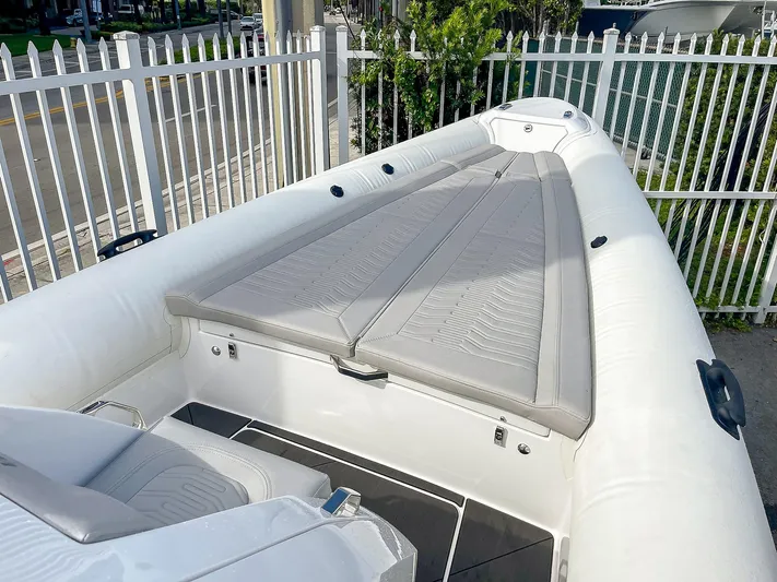  Yacht Photos Pics 2025 Ribco Venom 30 boat with sleek white seating and modern design.