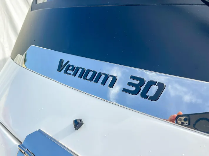  Yacht Photos Pics 2025 Ribco Venom 30 boat nameplate with reflective surface.