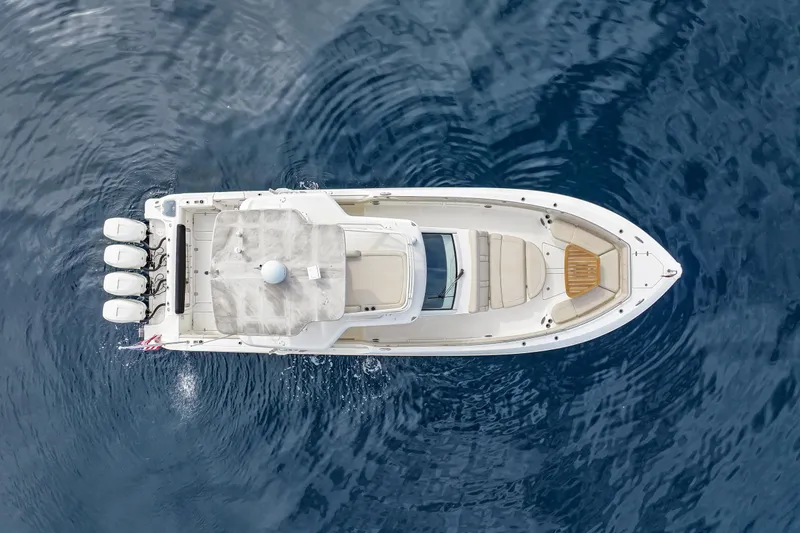 Fan Tail III Yacht Photos Pics Aerial view of 2018 Boston Whaler 420 Outrage boat on calm blue water.