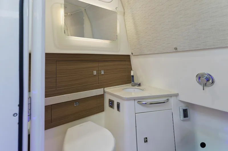 Fan Tail III Yacht Photos Pics 2018 Boston Whaler 420 Outrage bathroom with modern sink and wood accents.