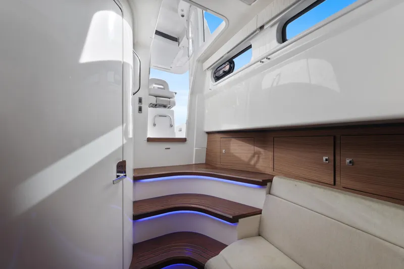 Fan Tail III Yacht Photos Pics Interior of 2018 Boston Whaler 420 Outrage, featuring sleek design and modern wood accents.