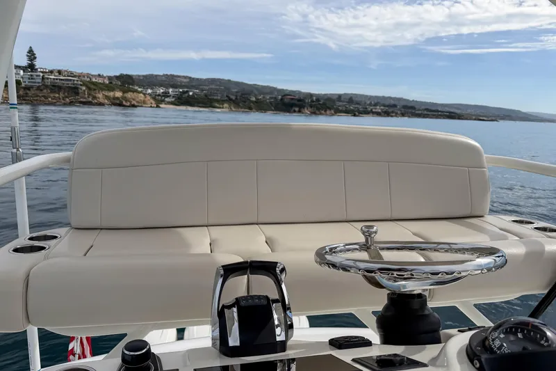 Fan Tail III Yacht Photos Pics 2018 Boston Whaler 420 Outrage helm with luxurious seating and ocean view.