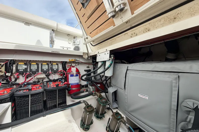 Fan Tail III Yacht Photos Pics 2018 Boston Whaler 420 Outrage engine compartment with batteries and fire extinguisher.