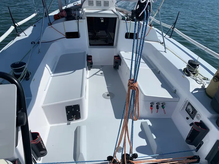 Ace Yacht Photos Pics 2019 J Boats J/121 sailboat cockpit with ropes and winches on a sunny day.
