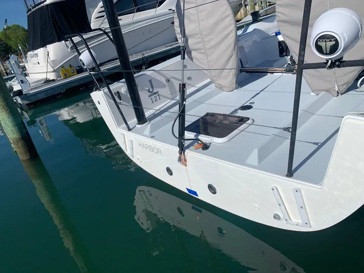 Ace Yacht Photos Pics 2019 J Boats J/121 sailboat docked in marina, rear view.