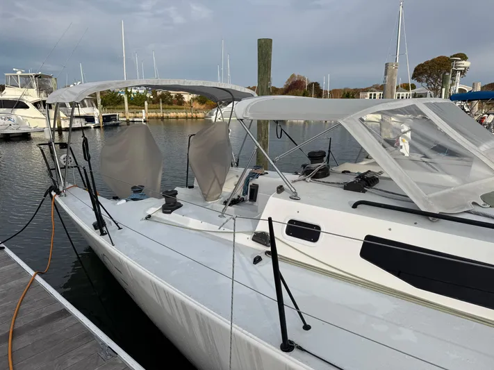 Ace Yacht Photos Pics 2019 J Boats J/121 sailboat docked at marina with canopy.