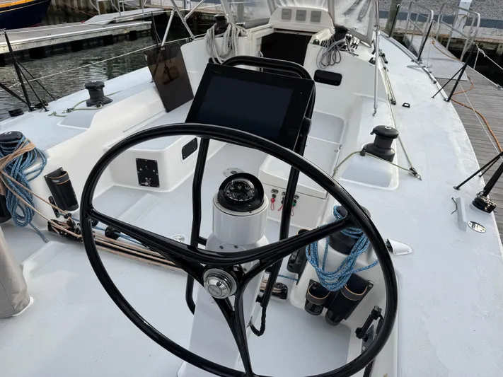 Ace Yacht Photos Pics 2019 J Boats J/121 sailboat cockpit with steering wheel and navigation equipment.