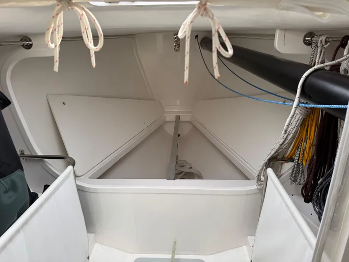 Ace Yacht Photos Pics 2019 J Boats J/121 interior storage compartment with ropes and equipment.