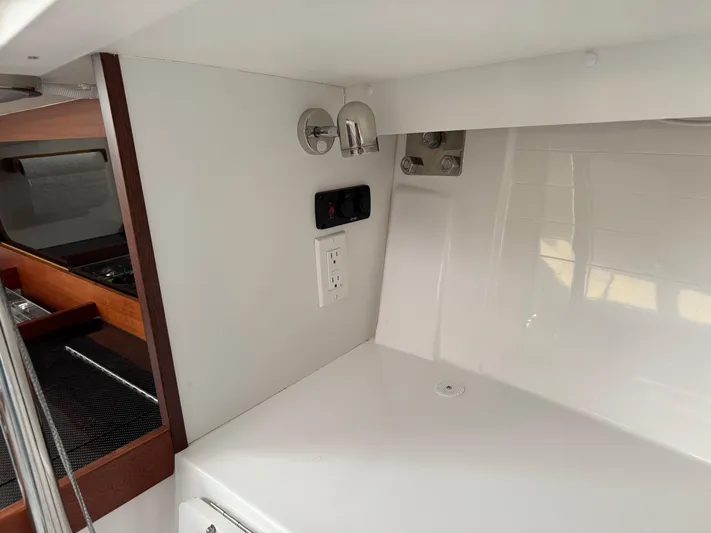 Ace Yacht Photos Pics Interior of 2019 J Boats J/121 yacht, featuring modern electrical outlet and sleek design.