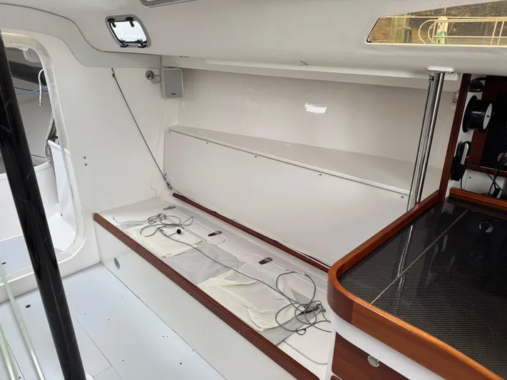 Ace Yacht Photos Pics 2019 J Boats J/121 interior with sleek white design and wooden accents.