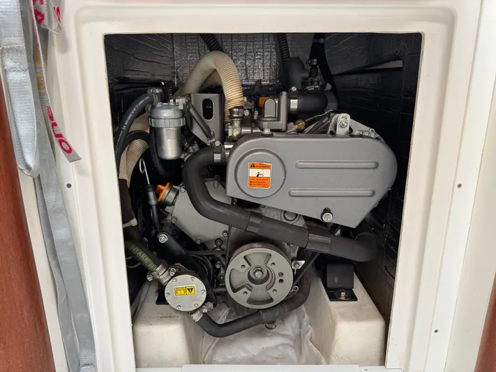 Ace Yacht Photos Pics Engine compartment of a 2019 J Boats J/121 sailboat, showcasing mechanical components.