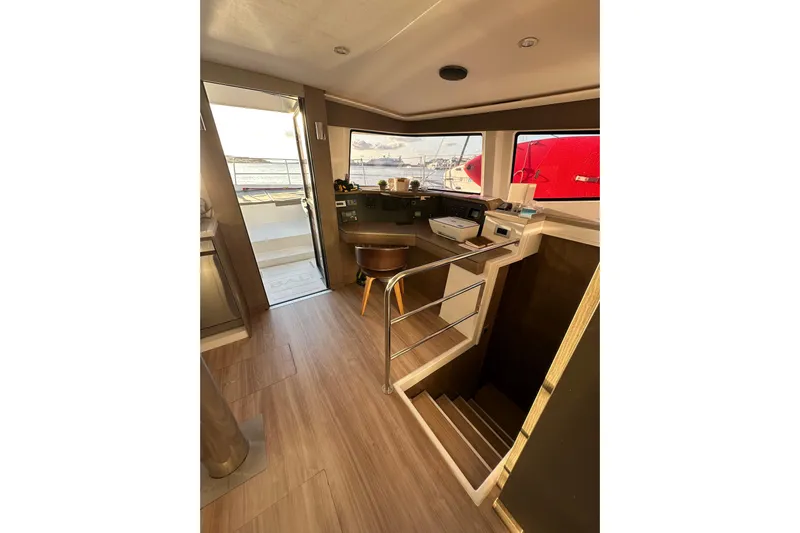 Platinum Yacht Photos Pics Interior of 2023 Bali 4.6 yacht with modern helm and wooden flooring.