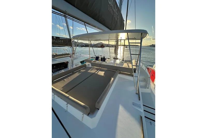 Platinum Yacht Photos Pics Luxurious 2023 Bali 4.6 catamaran with sun deck, sailing at sunset.