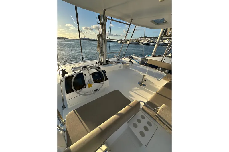 Platinum Yacht Photos Pics Modern 2023 Bali 4.6 yacht cockpit with seating, steering wheel, and ocean view.