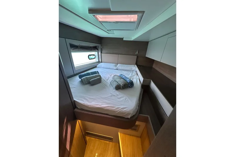 Platinum Yacht Photos Pics Luxurious cabin interior of 2023 Bali 4.6 yacht with cozy bed and skylight.
