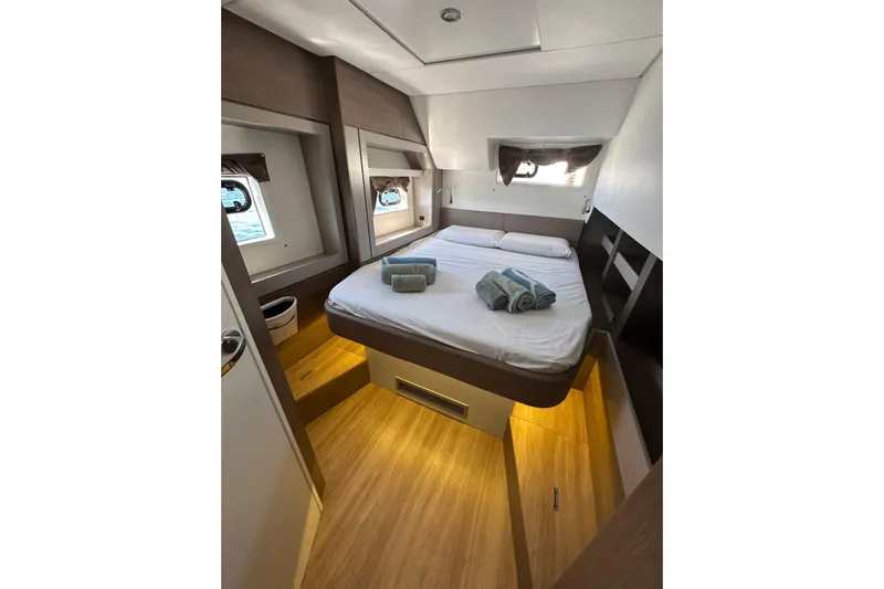 Platinum Yacht Photos Pics Luxurious cabin interior of 2023 Bali 4.6 yacht with cozy bed and ambient lighting.