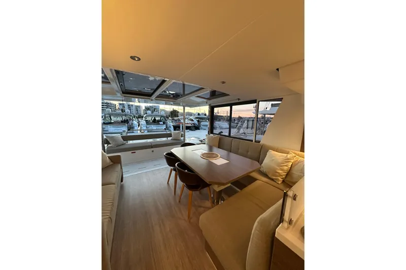 Platinum Yacht Photos Pics Luxurious interior of 2023 Bali 4.6 yacht with elegant seating and dining area.