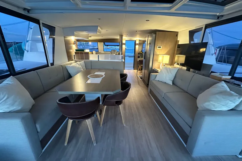 Platinum Yacht Photos Pics Luxurious interior of 2023 Bali 4.6 yacht with modern seating and dining area.