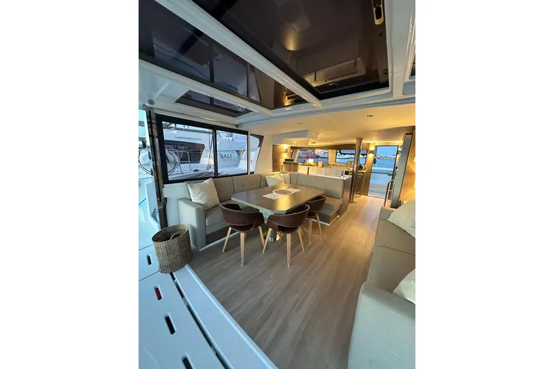 Platinum Yacht Photos Pics Luxurious interior of 2023 Bali 4.6 yacht with modern seating and dining area.
