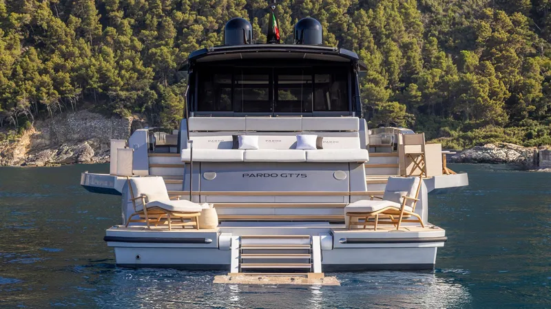  Yacht Photos Pics Luxury Pardo Yachts GT75, 2026 model, docked in serene waters with lush forest backdrop.