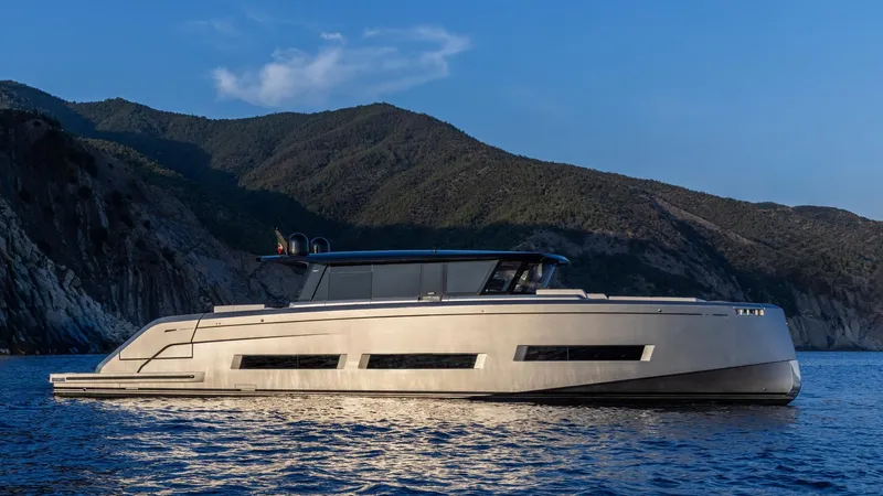  Yacht Photos Pics Luxury 2026 Pardo Yachts GT75 cruising near scenic coastline at sunset.