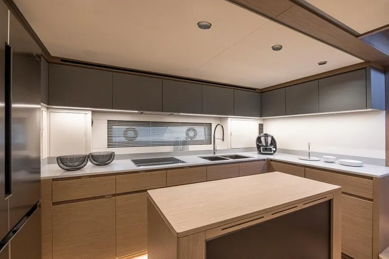  Yacht Photos Pics Modern kitchen interior of 2026 Pardo Yachts GT75, featuring sleek cabinetry and appliances.